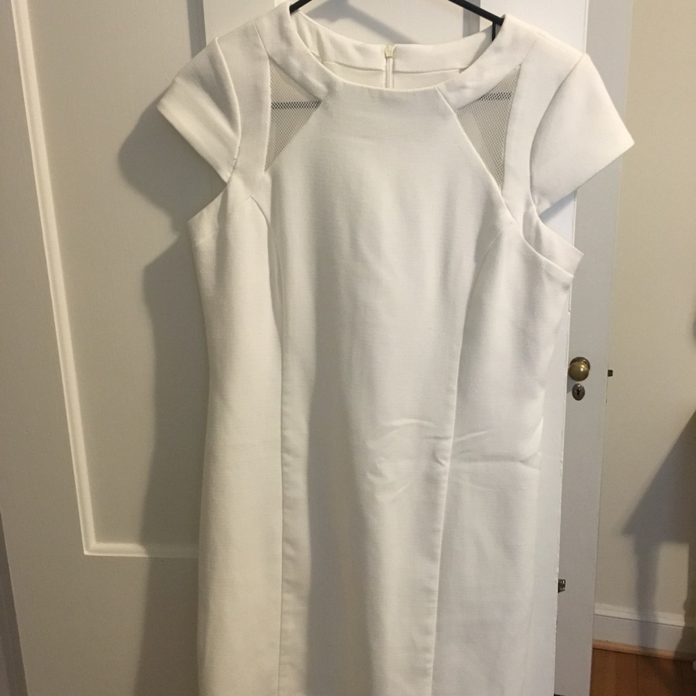 White fitted shift dress with cutouts